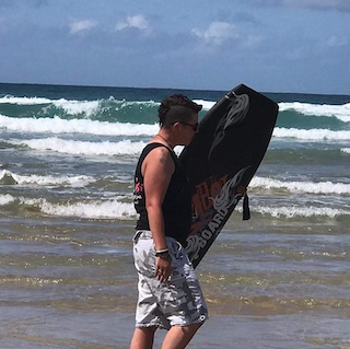 Article Image of Gemma Surfing on the beach