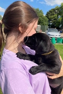 image of holly and a puppy