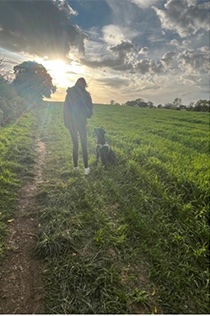 second image of holly walking her dog