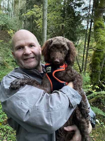 image of nick and his dog on a walk