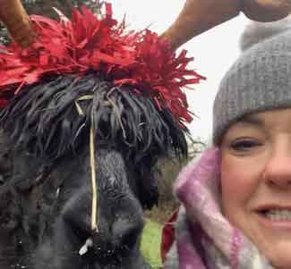 image of nicola with a alpaca dressed as a reindeer