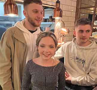 image of nicola and 2 men in a restaraunt