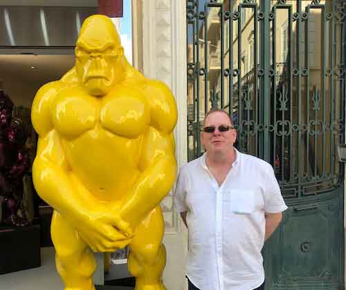 image of richard stood next to a big yellow gorilla statue