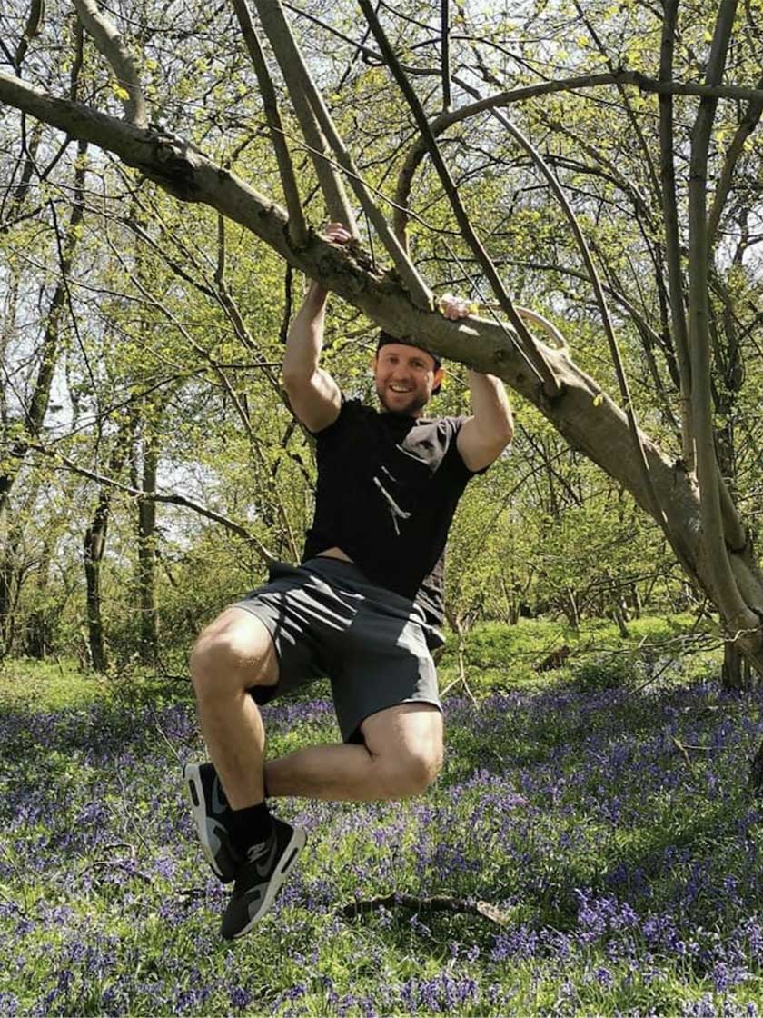 image of stuart climbing a tree